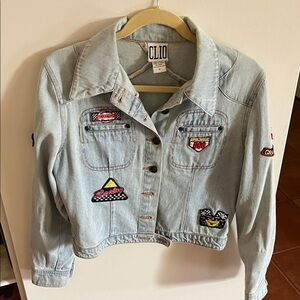 Vintage Clio Denim Jacket with Colorful Patches. Normal wear, no damage.